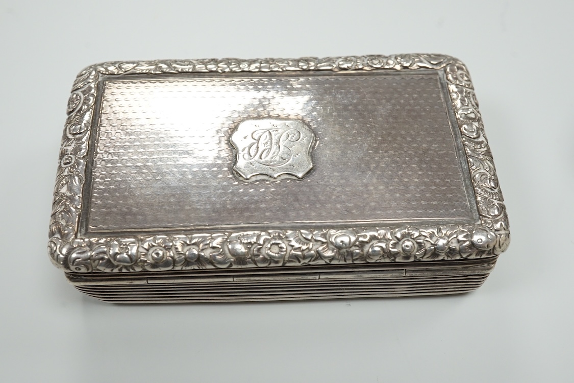 A late Victorian repousse silver navette shaped dish, by Charles Edwards, London, 1894, 25.7cm, with engraved monogram and date, together with a pair of mid 18th century silver sugar nips, an early 19th century silver vi